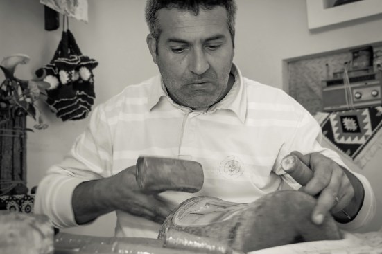 Bera, Albania. Luciano, woodcarver in his workshop in the old town